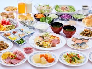 a table full of different types of food at Miyuki Hamabaru Resort in Onna