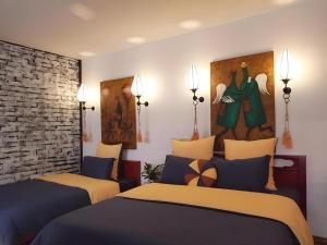 Postel nebo postele na pokoji v ubytování Gecko Hotel + 87 fotografií