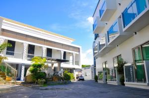 an empty street in front of a building at Eloisa Royal Suites in Mactan