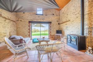 Posezení v ubytování Gite à La Ferme