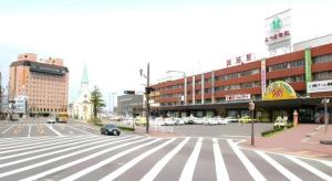 a city intersection with a crosswalk in a city at Kushiro Royal Inn in Irifunechō