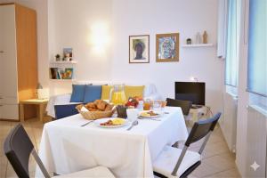 a living room with a table with food on it at Da Simona Appartamenti in Imperia +47 photos