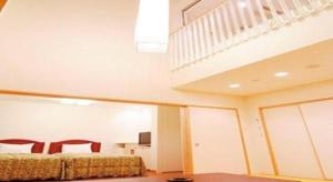 Ένα ή περισσότερα κρεβάτια σε δωμάτιο στο Sunshine Shirako New