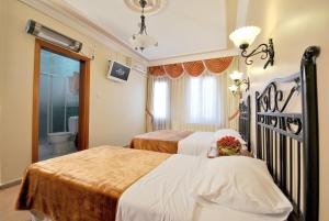 Postel nebo postele na pokoji v ubytování Side Hotel