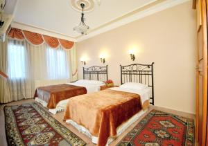 Postel nebo postele na pokoji v ubytování Side Hotel