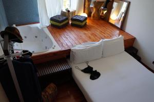 Posteľ alebo postele v izbe v ubytovaní Jacuzzi Rooms