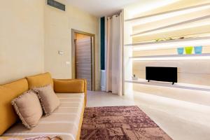 TV a/nebo společenská místnost v ubytování Bianco Mare Otranto