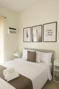 Postel nebo postele na pokoji v ubytování Verdant Villas at Eleve' Homes