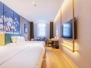 Postel nebo postele na pokoji v ubytování Jinjiang Inn Wuhan Linjiaohu Wanda Branch + 229 fotografií