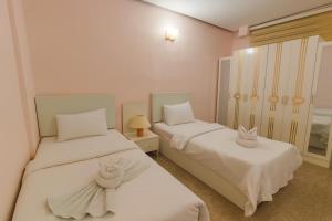 Ένα ή περισσότερα κρεβάτια σε δωμάτιο στο البيت الايطالي - Italiano House