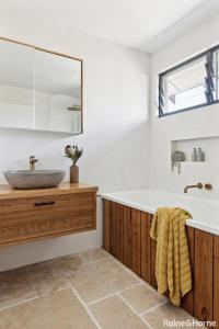 a bathroom with a large sink and a tub at Mariners Rest in Yamba