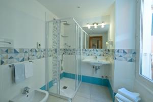 a bathroom with a shower and a sink at Hotel La Balnearia in Alassio +85 photos