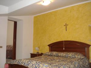A bed or beds in a room at Agriturismo La Fattoria