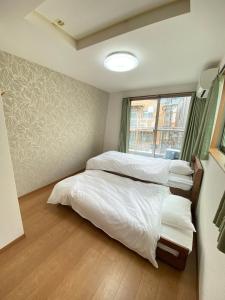 Postel nebo postele na pokoji v ubytování Hale 65 - Hale Collctions Tokyo