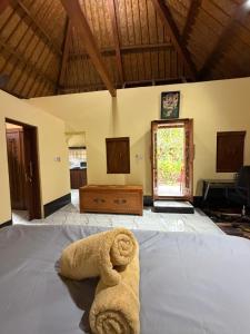 Postel nebo postele na pokoji v ubytování Puri Bali Bungalows