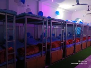 a group of bunk beds in a room at AC Comfort Guest House in Deoghar
