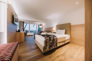 Postel nebo postele na pokoji v ubytování Rosenalp - Gesundheitsresort & Spa + 122 fotografií