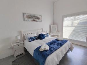 Postel nebo postele na pokoji v ubytování Khumbaya Self Catering