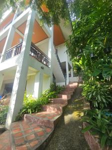 a building with steps leading up to it at Seaview Studio Jungle in Lamai