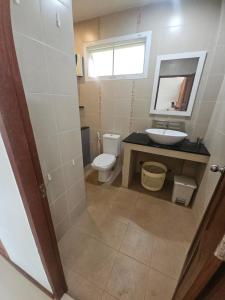 a bathroom with a toilet and a sink and a mirror at Seaview Studio Jungle in Lamai +9 photos