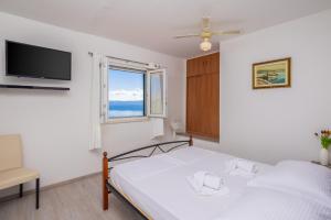 Postel nebo postele na pokoji v ubytování Villa Marevista + 69 fotografií