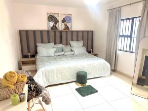 Ένα ή περισσότερα κρεβάτια σε δωμάτιο στο VinVid Harties Guest House