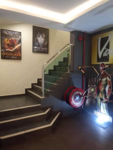 a room with stairs with a superhero on the wall at Vitro Hotel in Johor Bahru