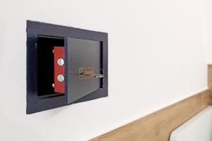 a black and red switch on a wall at Platinum - Il Centro Luxury Suites in Bari
