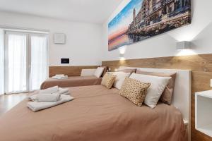 Postel nebo postele na pokoji v ubytování Platinum - Il Centro Luxury Suites