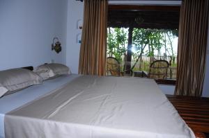 Alleppey Beach Garden客房内的一张或多张床位
