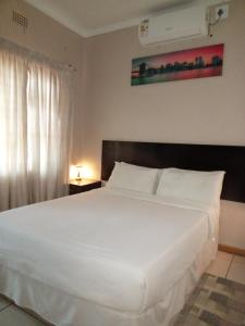 Postel nebo postele na pokoji v ubytování Vuya Nathi Bed and Breakfast + 50 fotografií