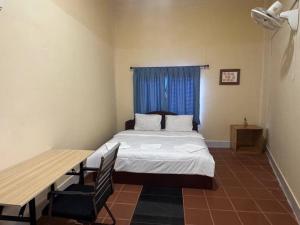 Ένα ή περισσότερα κρεβάτια σε δωμάτιο στο Kim Hong Guesthouse