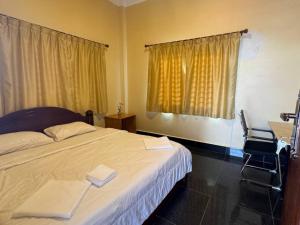 Ένα ή περισσότερα κρεβάτια σε δωμάτιο στο Kim Hong Guesthouse