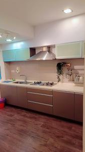 a kitchen with a sink and a stove top oven at Lumut Valley in Lumut +43 photos
