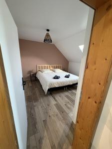 Postel nebo postele na pokoji v ubytování A l'ancienne boulangerie