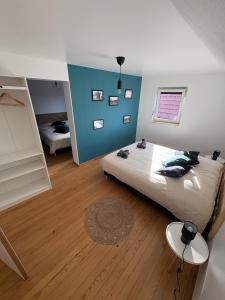 Postel nebo postele na pokoji v ubytování A l'ancienne boulangerie