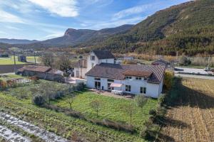 an aerial view of a house in the mountains at L'Eco-logis du Clos Des Tilleuls in Molieres-Glaudaz