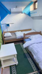 Postel nebo postele na pokoji v ubytování Retro II