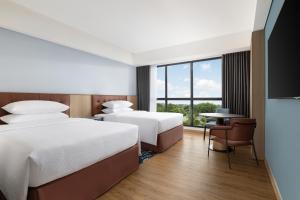 Ένα ή περισσότερα κρεβάτια σε δωμάτιο στο Four Points by Sheraton Pontianak +5 φωτογραφίες