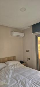 Ένα ή περισσότερα κρεβάτια σε δωμάτιο στο Complexe derhem traiteur