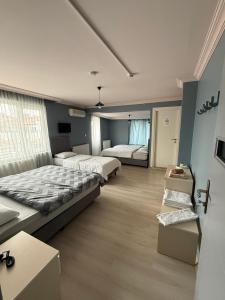 Ένα ή περισσότερα κρεβάτια σε δωμάτιο στο Flora Otel 16 rooms