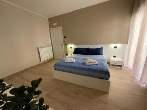 Postel nebo postele na pokoji v ubytování Casa Viale Kennedy