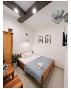 Ένα ή περισσότερα κρεβάτια σε δωμάτιο στο Kim Quang