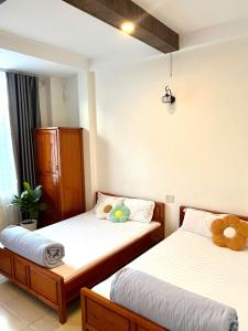 Ένα ή περισσότερα κρεβάτια σε δωμάτιο στο Kim Quang +11 φωτογραφίες