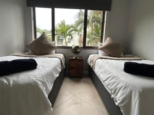 Postel nebo postele na pokoji v ubytování Beachfront Luxury 7 Chaka's Place Ballito