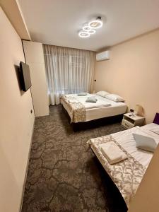 Ένα ή περισσότερα κρεβάτια σε δωμάτιο στο Hotel Ponti