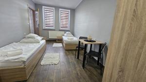 Postel nebo postele na pokoji v ubytování Noclegi Jodłowa