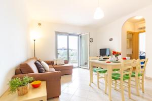 Et opholdsområde på Appartamento Zara 3 - MyHo Casa