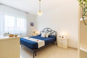 En eller flere senge i et værelse på Appartamento Zara 3 - MyHo Casa