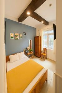 Ένα ή περισσότερα κρεβάτια σε δωμάτιο στο Kim Quang